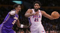 Philadelphia 76ers center Joel Embiid (21) is defended by Los Angeles Lakers center Deandre Ayton (5) in the first half at Crypto.com Arena