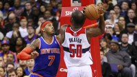 New York Knicks small forward Carmelo Anthony (7) knocks the ball from Washington Wizards center Emeka Okafor (50) in the fourth quarter at Verizon Center. The Knicks won 96-88. Mandatory Credit: Geoff Burke-Imagn Images