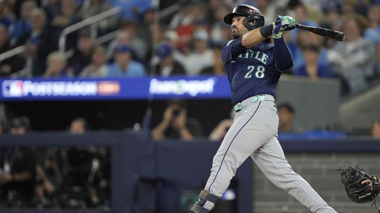 Seattle Mariners third baseman Eugenio Suarez (28) hits a single against the Toronto Blue Jays in the second inning during game seven of the ALCS round for the 2025 MLB playoffs at Rogers Centre