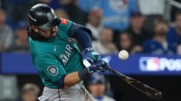 Seattle Mariners third baseman Eugenio Suarez (28) hits a RBI single in the sixth inning against the Toronto Blue Jays during game six of the ALCS round for the 2025 MLB playoffs at Rogers Centre.