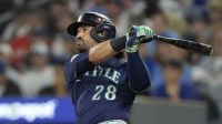 Seattle Mariners third baseman Eugenio Suarez (28) hits a single against the Toronto Blue Jays in the second inning during game seven of the ALCS round for the 2025 MLB playoffs at Rogers Centre.