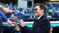 Tom Brady signs autographs before the 2026 NFC Championship Game between the Seattle Seahawks and the Los Angeles Rams at Lumen Field.