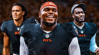 LT Overton, Eli Stowers, Michael Trigg all beside each other in Atlanta Falcons uniforms - NFL Draft wallpaper in the background
