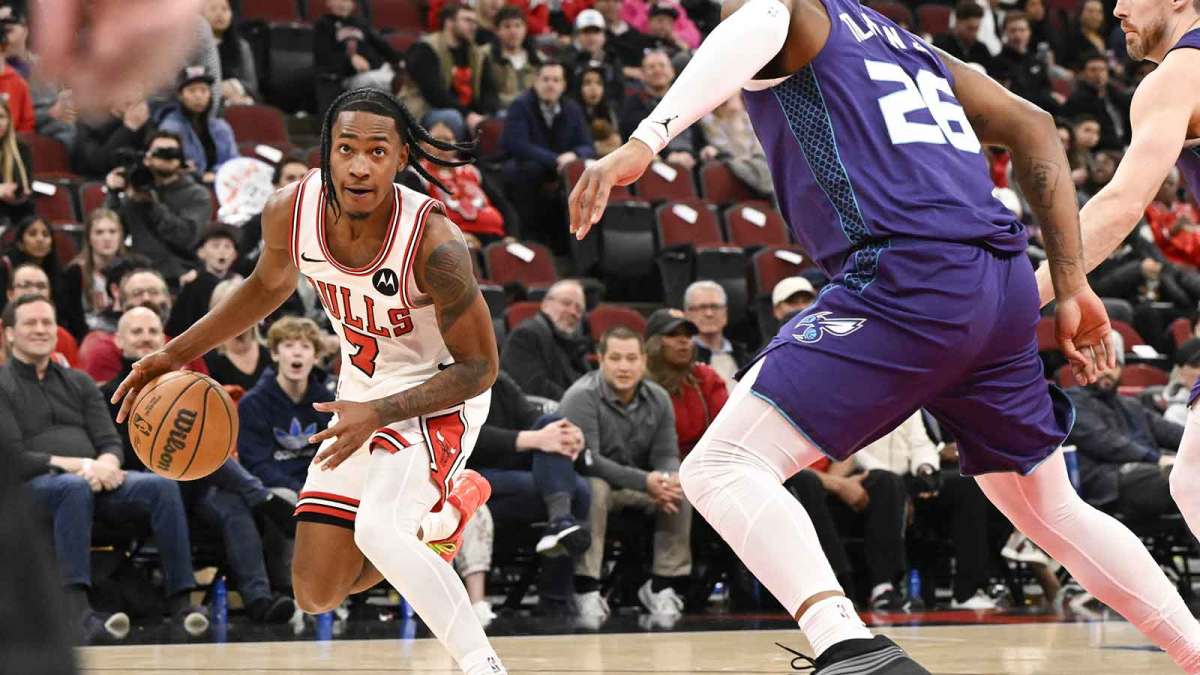 Feb 24, 2026; Chicago, Illinois, USA; Chicago Bulls guard Rob Dillingham (7) dribbles against Charlotte Hornets forward Xavier Tillman (26) during the second half at United Center. Mandatory Credit: Matt Marton-Imagn Images