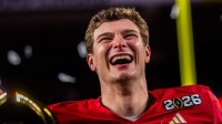Indiana's Fernando Mendoza (15) smiles on the podium after the College Football Playoff National Championship college football game at Hard Rock Stadium in Miami Gardens on Monday, Jan. 19, 2026.