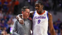 Florida center Rueben Chinyelu (9) talks with Florida head coach Todd Golden as he comes off court during the second half of a NCAA mens basketball game against South Carolina at Steven C. O'Connell Center Exactek arena.