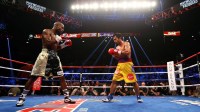 Manny Pacquiao (right) against Floyd Mayweather during their boxing bout at the MGM Grand Garden Arena. Mandatory Credit: Mark J. Rebilas-Imagn Images