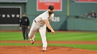 Boston Red Sox starting pitcher Lucas Giolito (54) pitches against the Athletics during the first inning at Fenway Park.