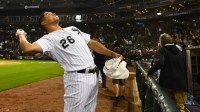 Chicago White Sox right fielder Avisail Garcia (26) throws tee shirts into the crowd after the game against the Cleveland Indians at Guaranteed Rate Field.