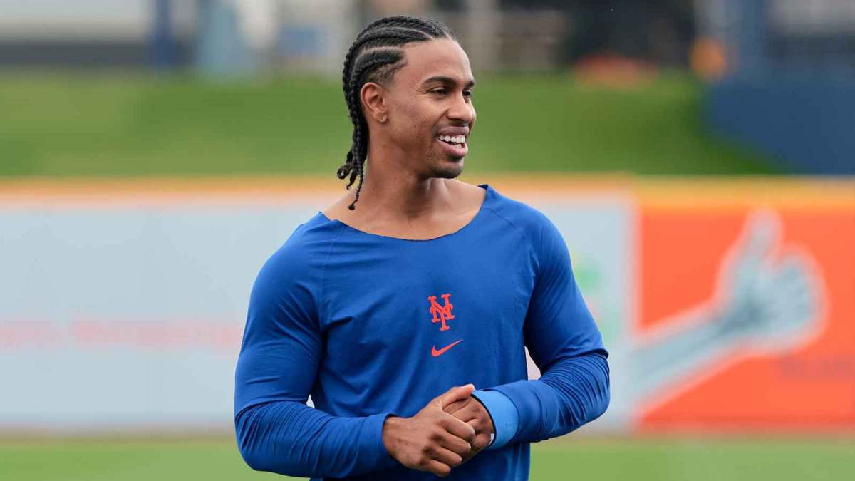 New York Mets infielder Francisco Lindor (12) speaks to bench coach Kai Correa (not pictured) during spring training at Clover Park