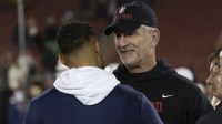 Stanford Cardinal head coach Frank Reich (right) speaks with Notre Dame Fighting Irish head coach Marcus Freeman after the game at Stanford Stadium.