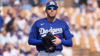 Los Angeles Dodgers infielders Freddie Freeman (5) returns to the field for the fourth inning of a spring training game against the Chicago Cubs at Camelback Ranch-Glendale.