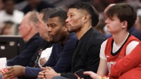 Notre Dame head football coach Marcus Freeman watches the Houston Rockets pay the San Antonio Spurs in the second half at Toyota Center.