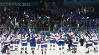 Feb 10, 2026; Milan, Italy; United States players celebrate after defeating Canada in women's ice hockey group A play during the Milano Cortina 2026 Olympic Winter Games at Milano Santagiulia Ice Hockey Arena. Mandatory Credit: Geoff Burke-Imagn Images