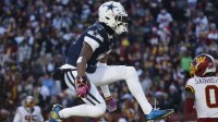 Dallas Cowboys wide receiver George Pickens (3) celebrates after a play against the Washington Commanders during the first half at Northwest Stadium.