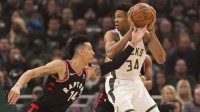 Toronto Raptors guard Danny Green (14) defends Milwaukee Bucks forward Giannis Antetokounmpo (34) during the first quarter in game two of the Eastern conference finals of the 2019 NBA Playoffs at Fiserv Forum.
