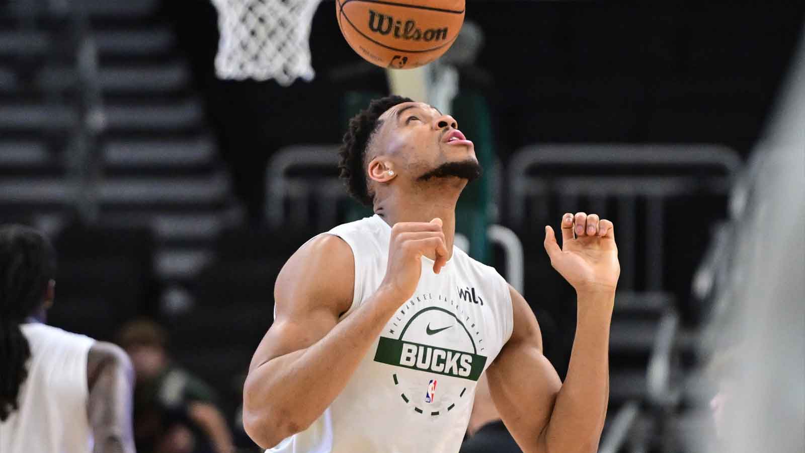 Milwaukee Bucks forward Giannis Antetokounmpo (34) bounces the ball on his head while warming up before game against the Indiana Pacers at Fiserv Forum. 