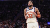 New York Knicks center Karl-Anthony Towns (32) celebrates after scoring in the third quarter against the Houston Rockets at Madison Square Garden.