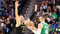 Golden State Warriors center Kristaps Porzingis (7) guards Boston Celtics center Nikola Vucevic (4) during the third quarter at Chase Center.
