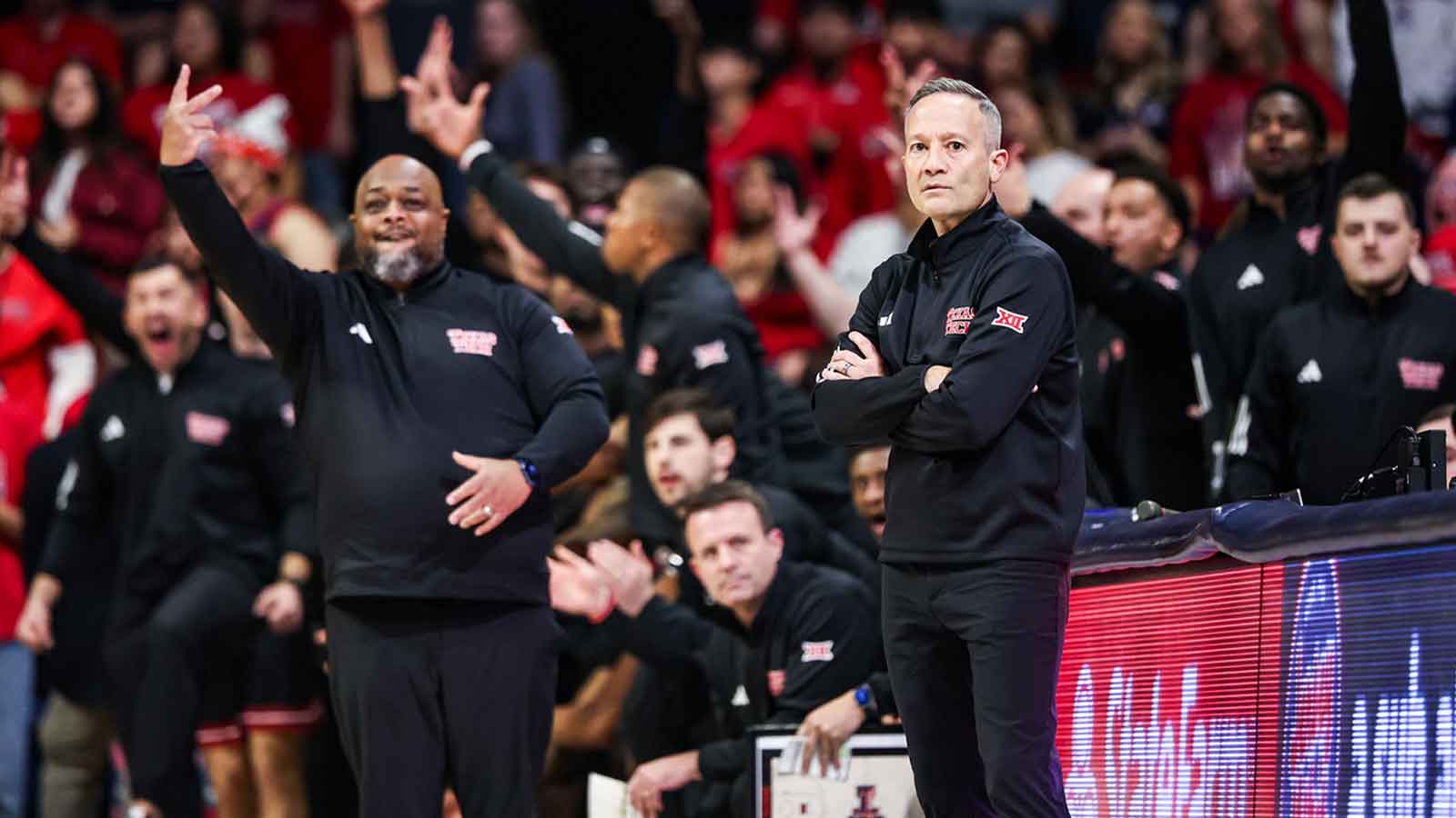 Texas Tech Red Raiders head coach Grant McCasland watches as a player scores a three-point basket during the first half of the game against the Arizona Wildcats at McKale Memorial Center.