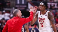 Texas Tech head coach Grant McCasland high-fives JT Toppin during a non-conference basketball game, Friday, Nov. 29, 2024, at United Supermarkets Arena.