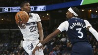 Feb 2, 2026; Memphis, Tennessee, USA; Memphis Grizzlies forward Cedric Coward (23) shoots as Minnesota Timberwolves forward Jaden McDaniels (3) defends during the second quarter at FedExForum. Mandatory Credit: Petre Thomas-Imagn Images