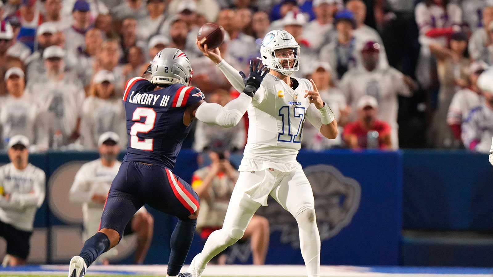 Buffalo Bills quarterback Josh Allen (17) throws the ball against New England Patriots linebacker Harold Landry III (2) during the first half at Highmark Stadium. 
