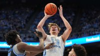 North Carolina Tar Heels center Henri Veesaar (13) shoots as Duke Blue Devils center Patrick Ngongba (21) and Duke Blue Devils forward Cameron Boozer (12) defend in the second half at Dean E. Smith Center.