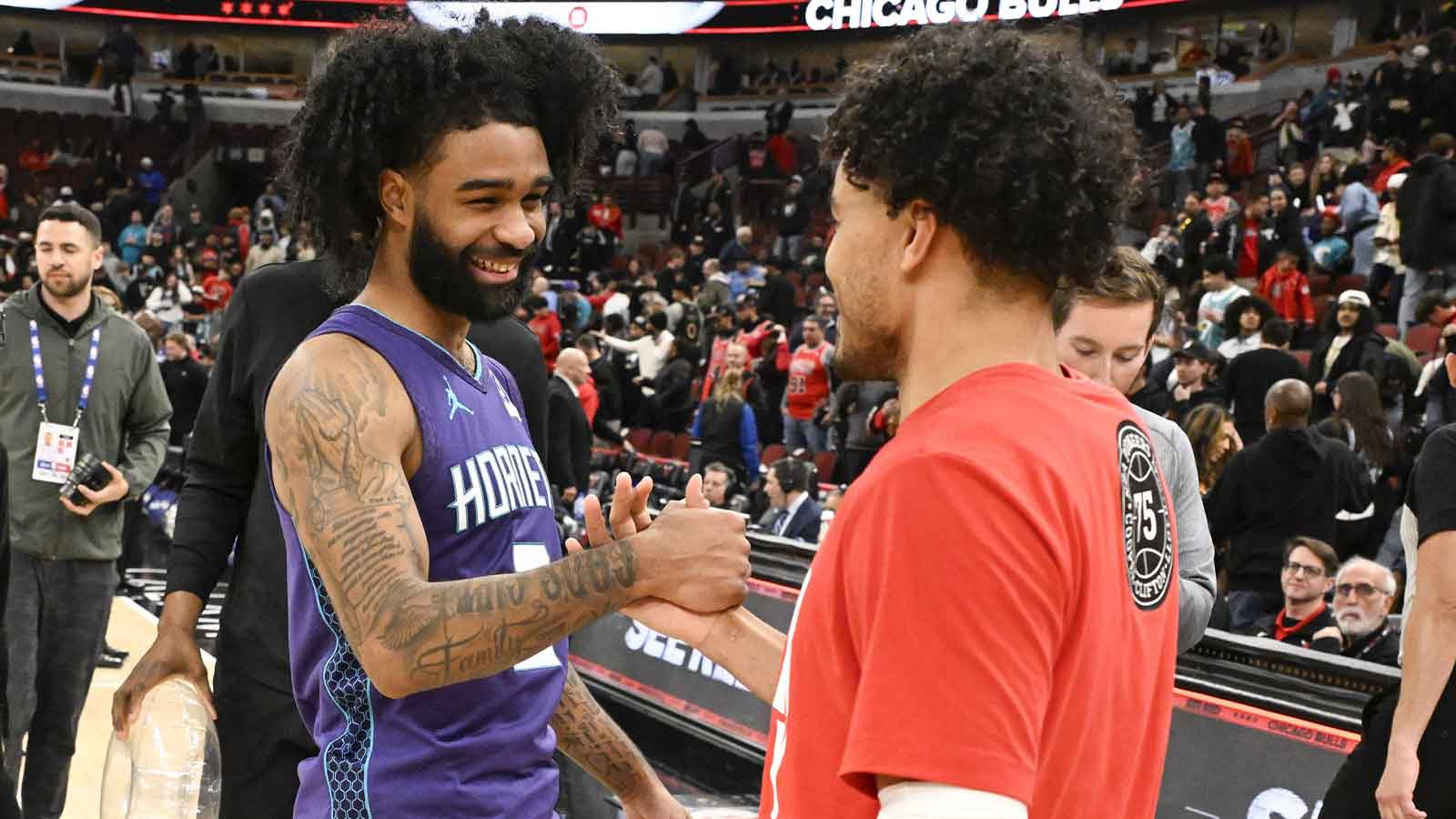 Hornets guard Coby White (3) shakes hands with Chicago Bulls guard Tre Jones (30) after a game at United Center