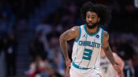 Hornets guard Coby White (3) celebrates a three point basket against the Portland Trail Blazers during the second half at Spectrum Center with Hornets' Miles Bridges in the background