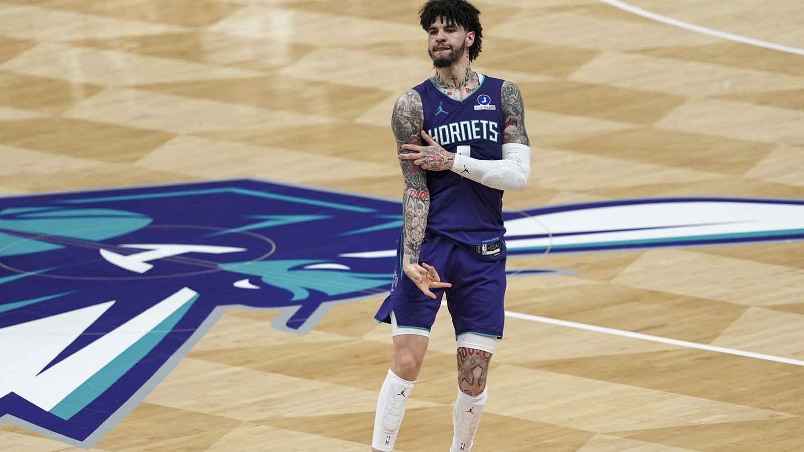 Hornets guard LaMelo Ball (1) reacts to his three point basket during the second half against the Atlanta Hawks at Spectrum Center