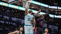 Hornets forward Miles Bridges dunks over Pistons' Isaiah Stewart