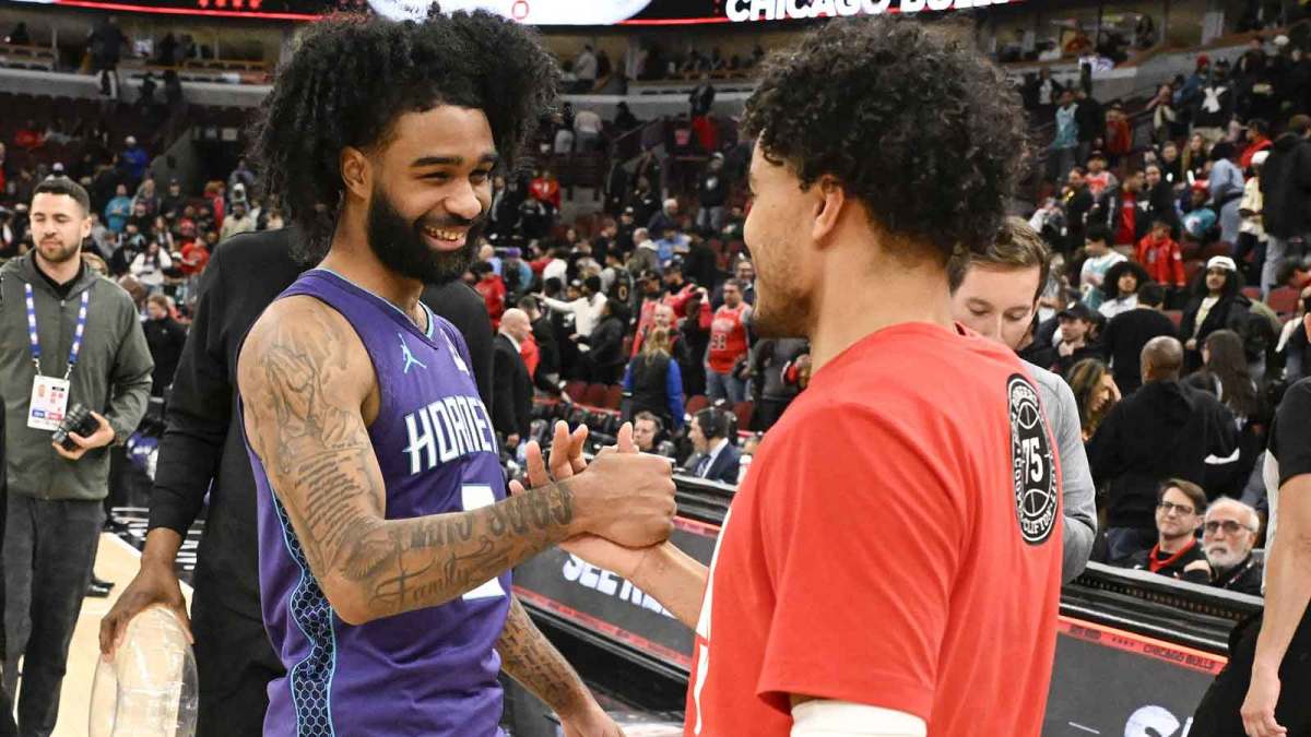 Hornets guard Coby White (3) shakes hands