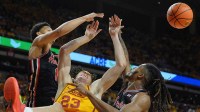 Houston Cougars guard Isiah Harwell (1) and Houston Cougars forward Joseph Tugler (11) knock out the ball from Iowa State Cyclones forward Blake Buchanan (23) during the first half in the Big-12 men’s basketball at Hilton Coliseum on Feb. 16, 2026, in Ames, Iowa