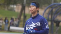 Los Angeles Dodgers second baseman Hyeseong Kim (6) gets ready to hit during spring training camp.