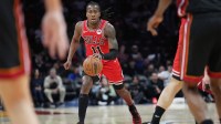 Chicago Bulls guard Ayo Dosunmu (11) brings th ball up the court against the Miami Heat during the first half at Kaseya Center.