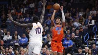 Oklahoma City Thunder forward Ousmane Dieng (13) shoots a three point basket as Phoenix Suns center Khaman Maluach (10) defends during the second half at Paycom Center.