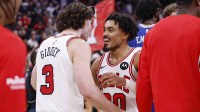 Chicago Bulls guard Josh Giddey (3)and guard Tre Jones (30) celebrate team's win against the Philadelphia 76ers at United Center.