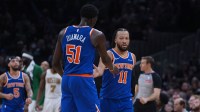 New York Knicks guard Jalen Brunson (11) reacts after his three point basket with forward Mohamed Diawara (51) as they take on the Boston Celtics in the second half at TD Garden.