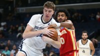 Memphis Grizzlies center Lawson Lovering (34) and Atlanta Hawks forward Jacob Toppin (0) battle for a rebound during the fourth quarter at FedExForum.