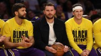 Los Angeles Lakers guard Luka Doncic (middle) watches a game against the Oklahoma City Thunder at Crypto.com Arena.