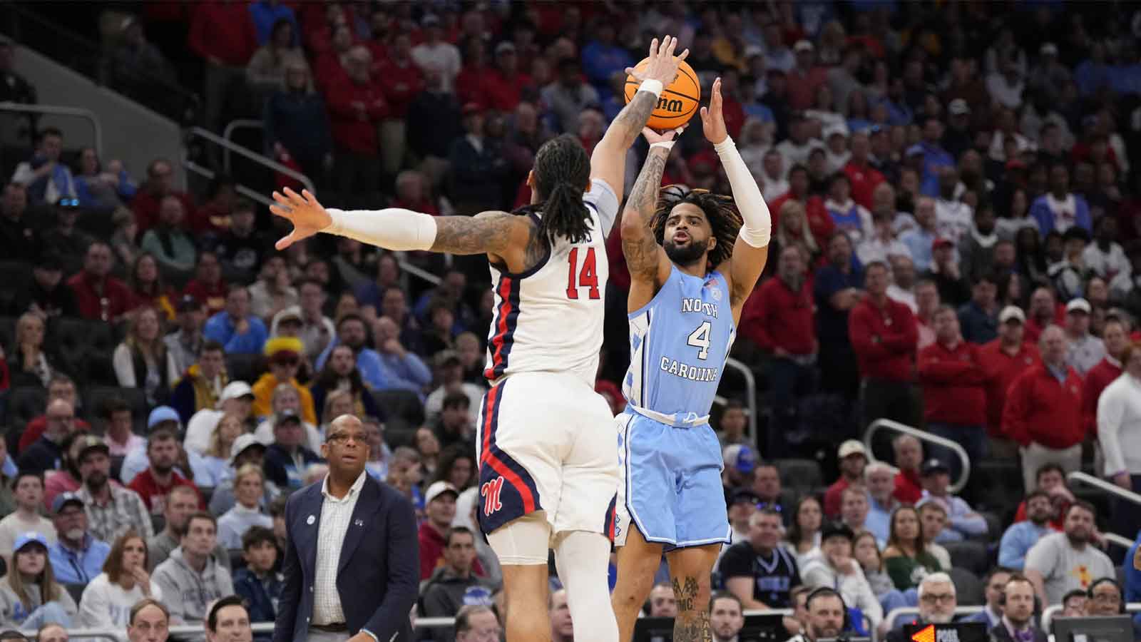 North Carolina Tar Heels guard RJ Davis (4) shoots against Mississippi Rebels guard Dre Davis (14) during the second half of a first round NCAA men’s tournament game at Fiserv Forum.