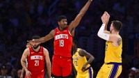Houston Rockets guard Nate Williams (19) blocks against Los Angeles Lakers guard Luka Doncic (77) during the second half at Crypto.com Arena.
