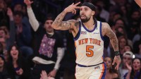 New York Knicks guard Jose Alvarado (5) gestures after making a three-point shot in the second quarter against the Houston Rockets at Madison Square Garden.