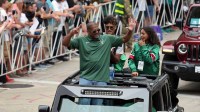 Milwaukee Bucks former player Marques Johnson rides in the Milwaukee Bucks victory parade in downtown Milwaukee.