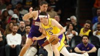 Phoenix Suns guard Collin Gillespie (12) defends against Los Angeles Lakers guard Austin Reaves (15) in the first half at Mortgage Matchup Center.