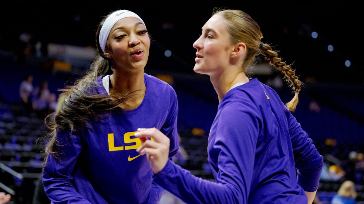 LSU Lady Tigers forward Angel Reese, left, and guard Izzy Besselman practice a handshake celebration routine that ends with air kisses before a game against the Florida Gators at Pete Maravich Assembly Center.