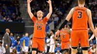 Illinois forward Jake Davis (15) celebrates a three-point basket during the first half against the UCLA Bruins at Pauley Pavilion presented by Wescom Financial.