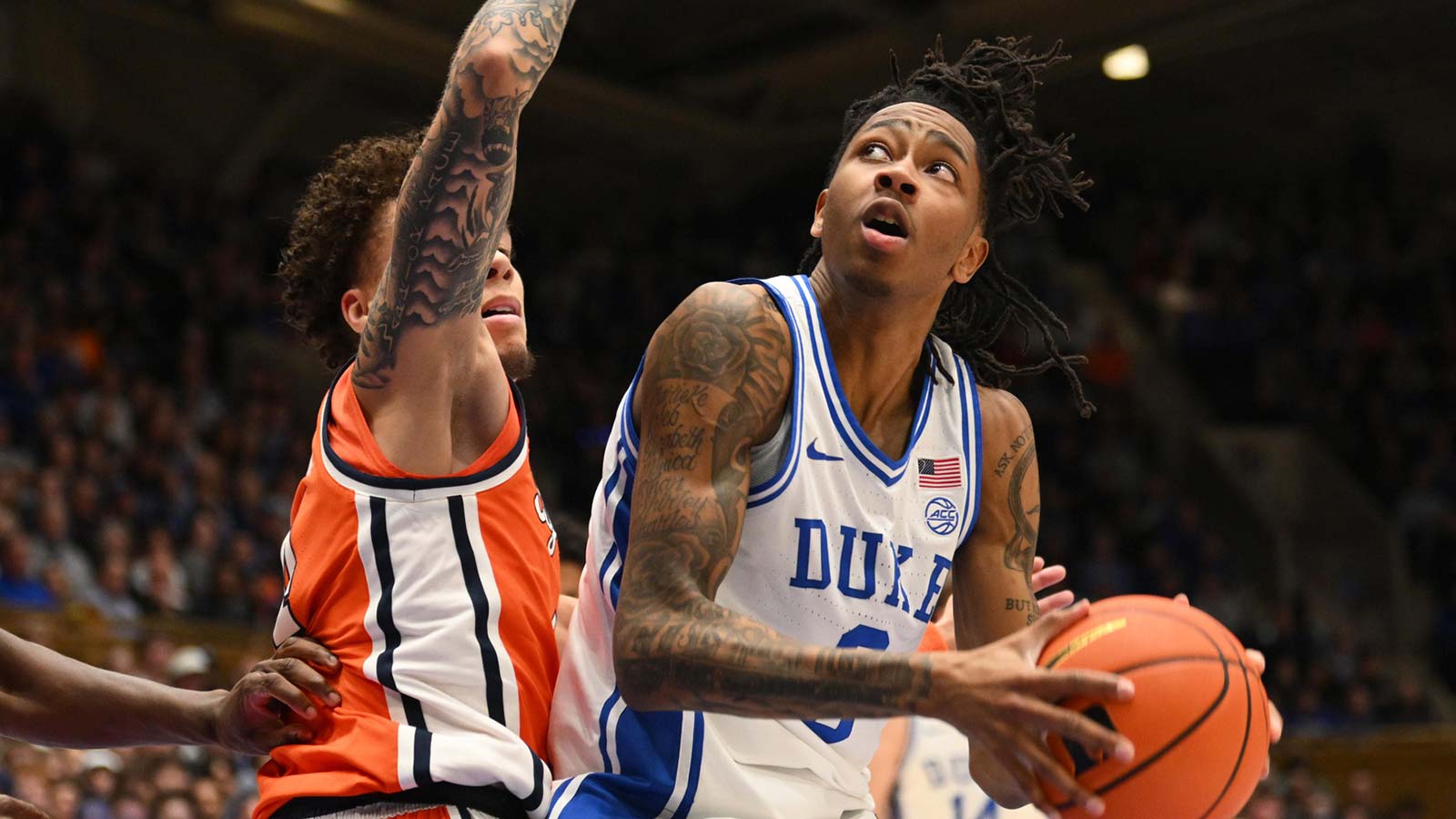 Duke Blue Devils guard Isaiah Evans (3) drives the ball around Syracuse Orange forward Sadiq White Jr. (0) during the h2 at Cameron Indoor Stadium.