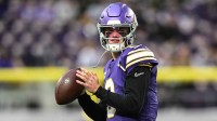 Minnesota Vikings quarterback J.J. McCarthy (9) warms up before the game against the Green Bay Packers at U.S. Bank Stadium.